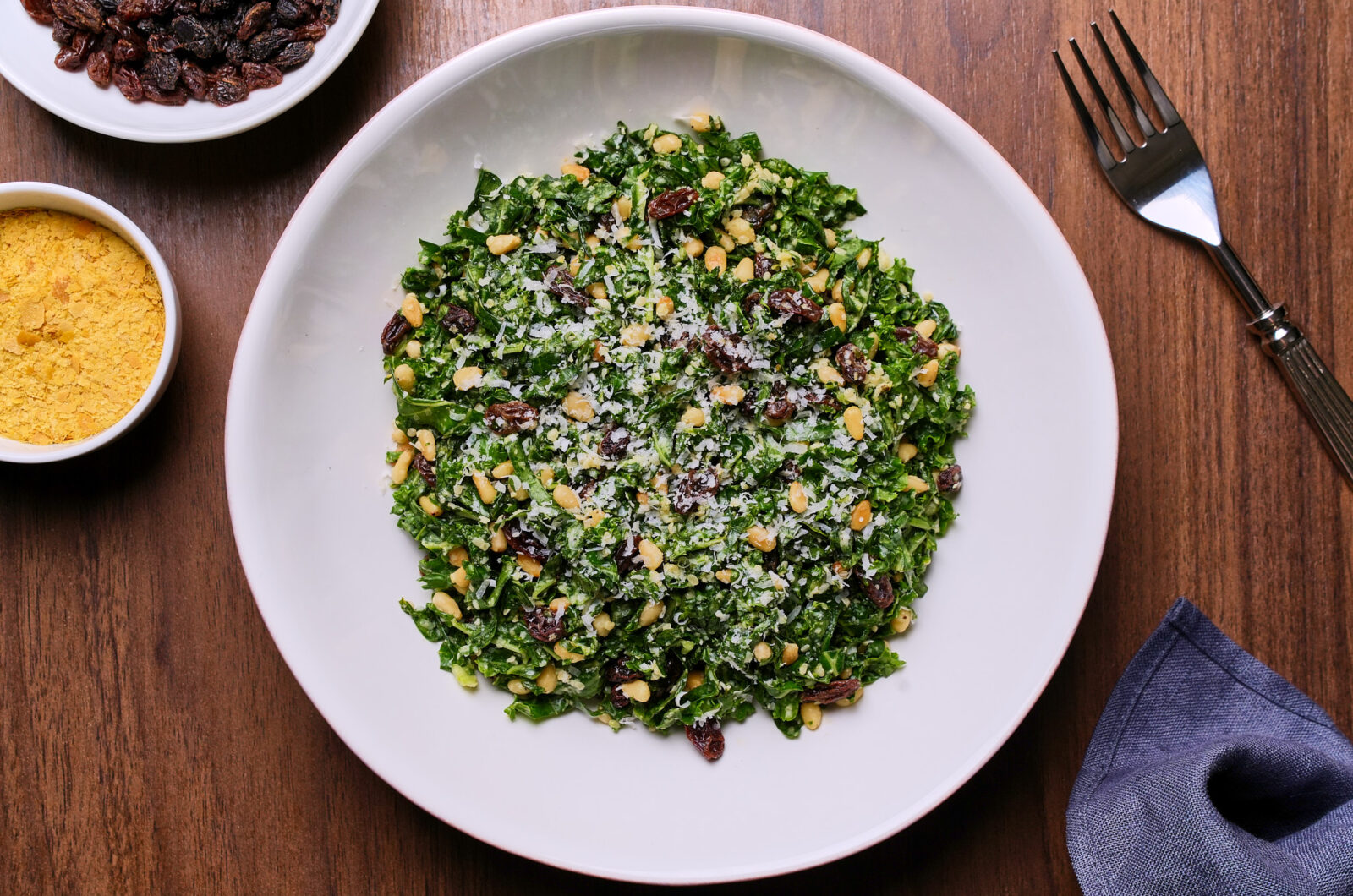 Kale Salad With Raisins, Pine Nuts and Parmesan