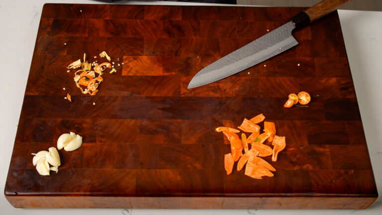 Cutting and preparing habanero peppers.